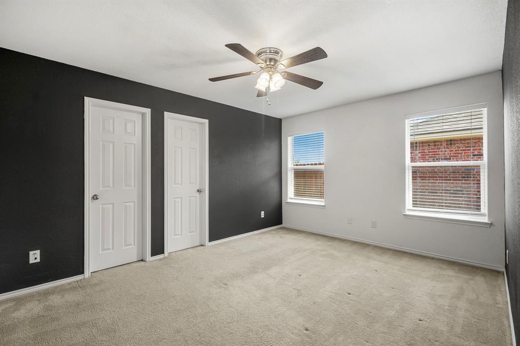 10620 Granada Drive Waco, TX 76708 - Photo 18 of 38 Neutral-toned carpeting complements the white and dark-painted walls
