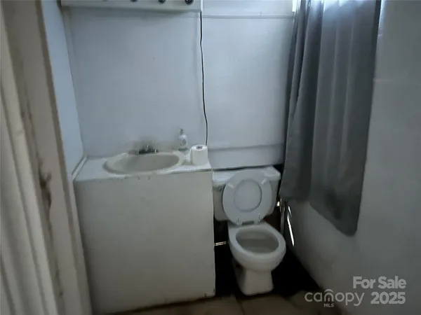 a bathroom with a toilet and a sink