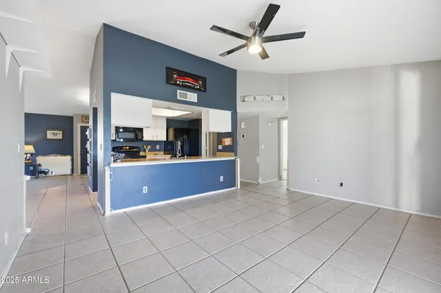 a open kitchen with cabinets and stainless steel appliances