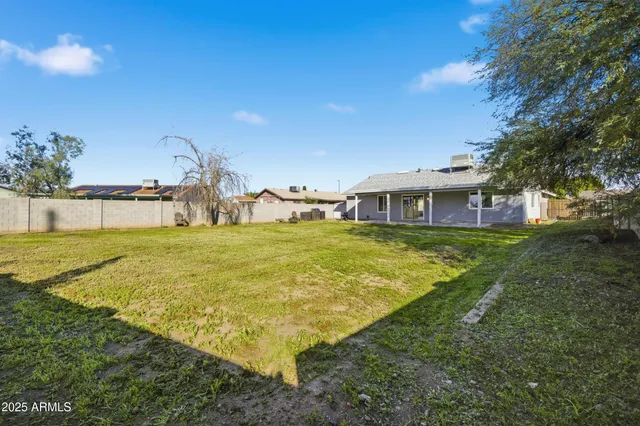 a house view with swimming pool in front of it