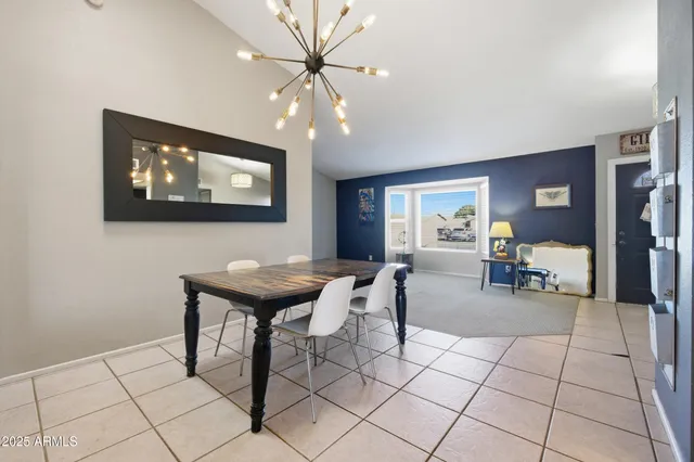 a living room with furniture and white walls