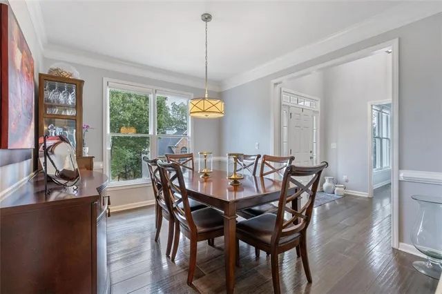 a bathroom with a granite countertop sink a mirror a vanity and a shower