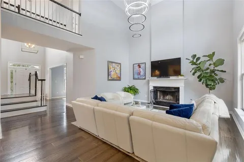 a living room with furniture and kitchen view