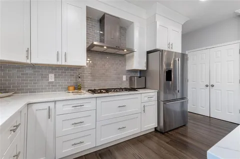 a bathroom with a shower and a glass door