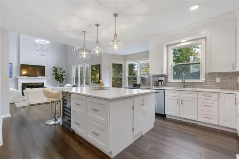 a bedroom with a bed and a ceiling fan