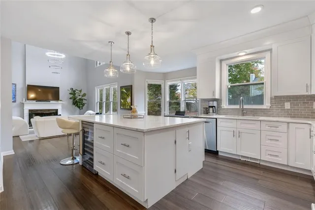 a bedroom with a bed and a ceiling fan
