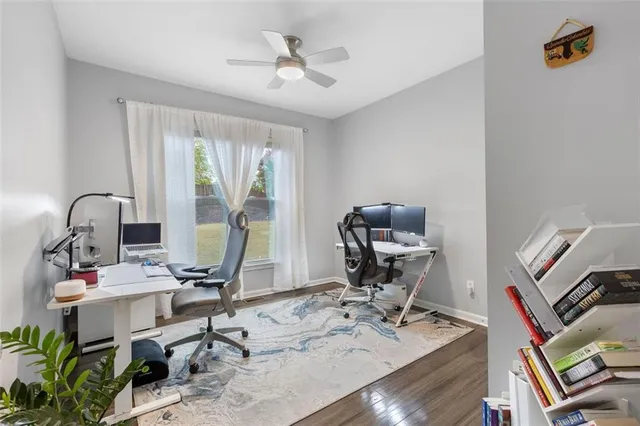 a picture of a room with a white wall and white refrigerator