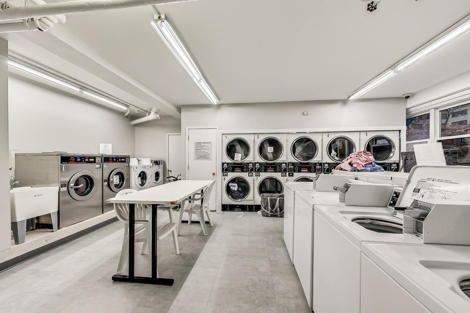 2909 North Sheridan Road, Unit 411 Chicago, IL 60657 - Photo 12 of 15 a utility room with dryer washer and other items