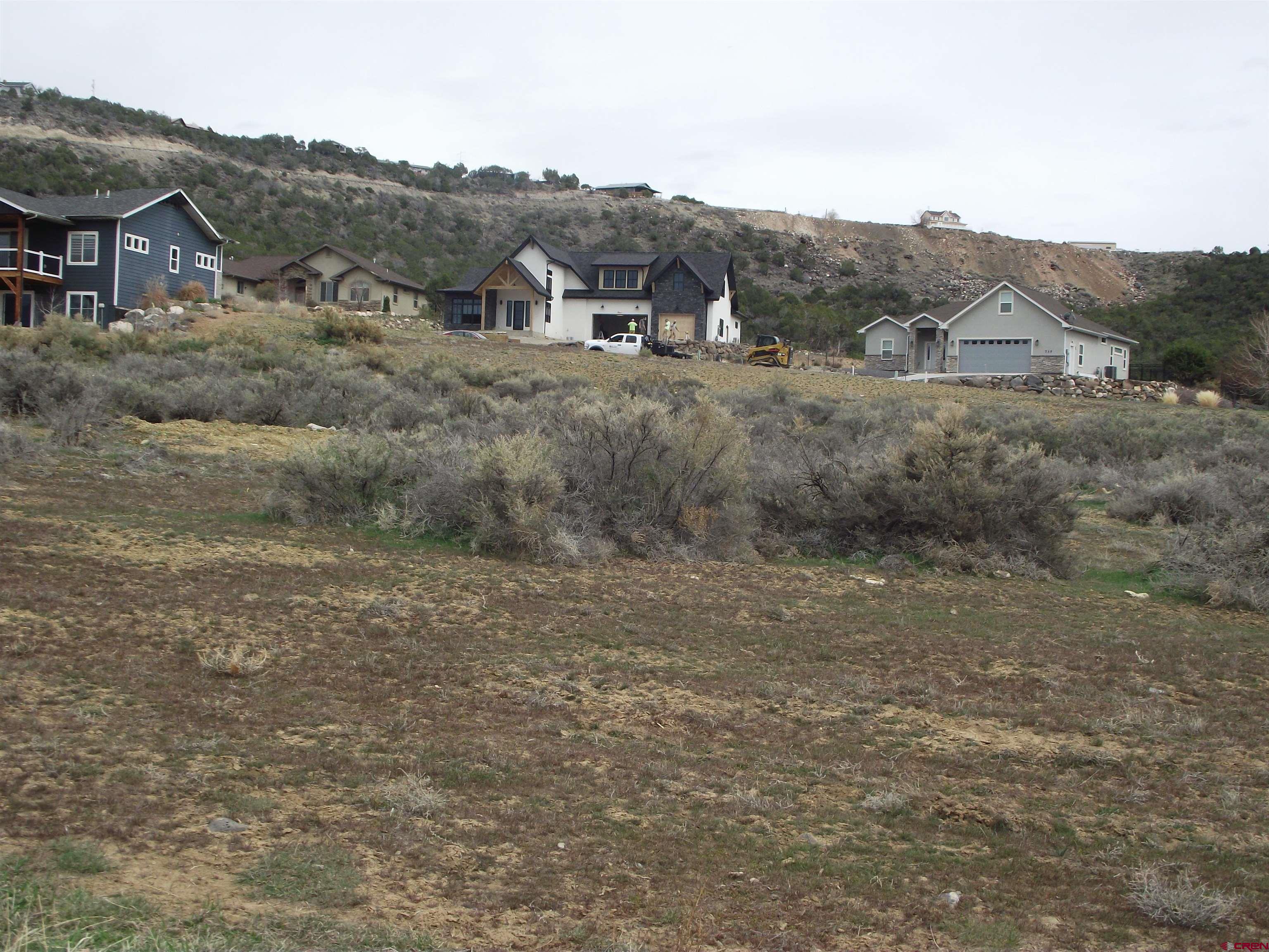 735 Southeast Pinyon Street Cedaredge, CO 81413 - Photo 11 of 12 a view of a mountain in the distance