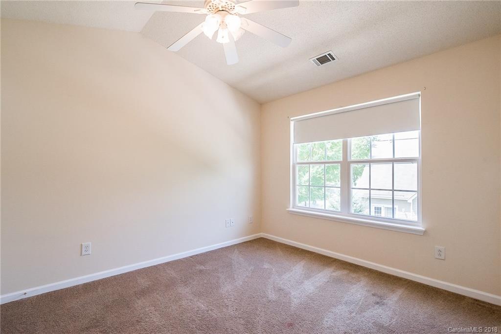11228 Grass Field Road Charlotte, NC 28213 - Photo 18 of 26 an empty room with a window