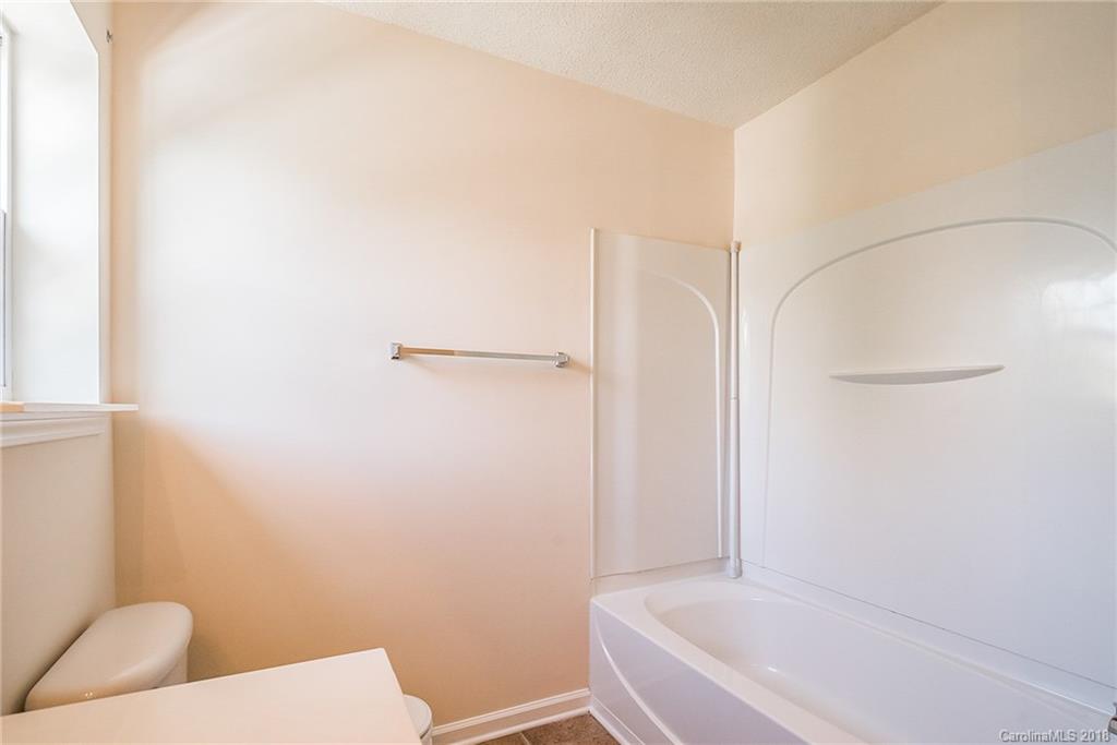 11228 Grass Field Road Charlotte, NC 28213 - Photo 20 of 26 a bathroom with a sink and a toilet
