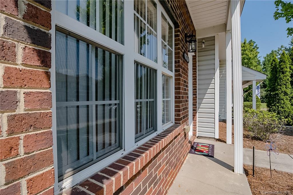 11228 Grass Field Road Charlotte, NC 28213 - Photo 3 of 26 a view of a balcony with wooden floor and fence and a window