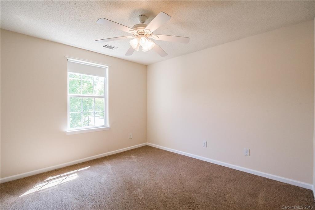 11228 Grass Field Road Charlotte, NC 28213 - Photo 22 of 26 an empty room with a window