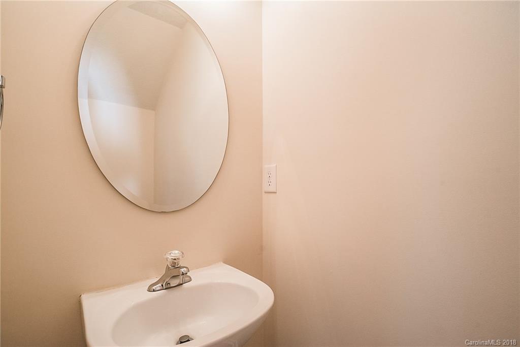11228 Grass Field Road Charlotte, NC 28213 - Photo 23 of 26 a bathroom with a sink and a mirror