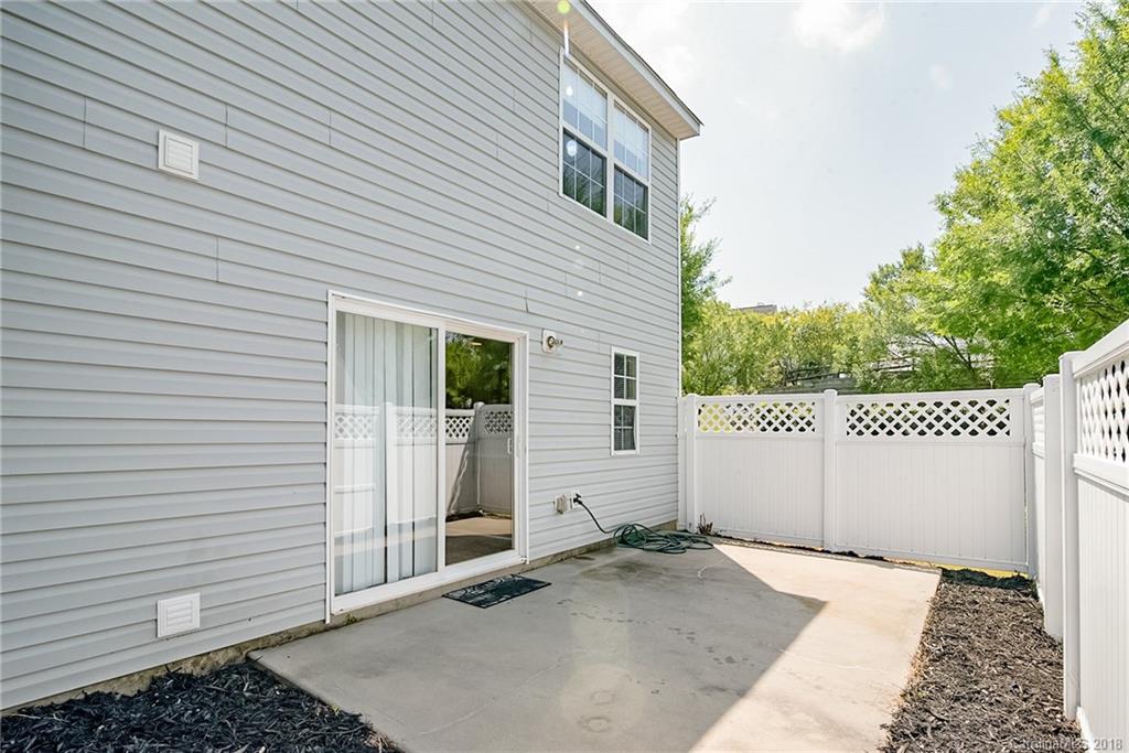 11228 Grass Field Road Charlotte, NC 28213 - Photo 25 of 26 a backyard of a house wit a garage