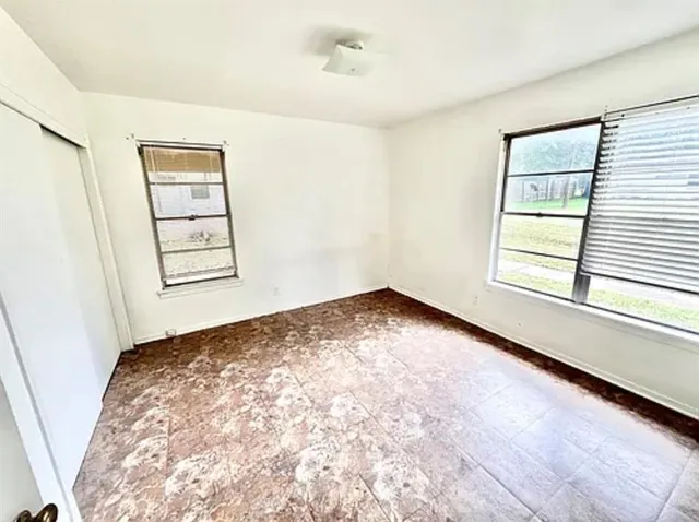 an empty room with windows