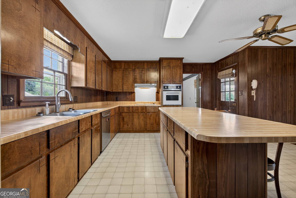 3369 Sandy Circle Macon, GA 31216 - Photo 2 of 65 a kitchen with stainless steel appliances granite countertop a kitchen island a stove a sink dishwasher and cabinets