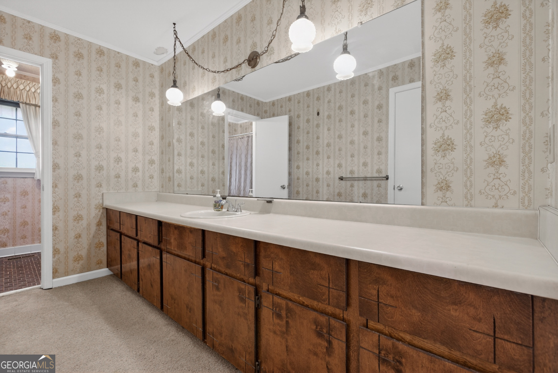 3369 Sandy Circle Macon, GA 31216 - Photo 22 of 65 a bathroom with a double vanity sink and a mirror