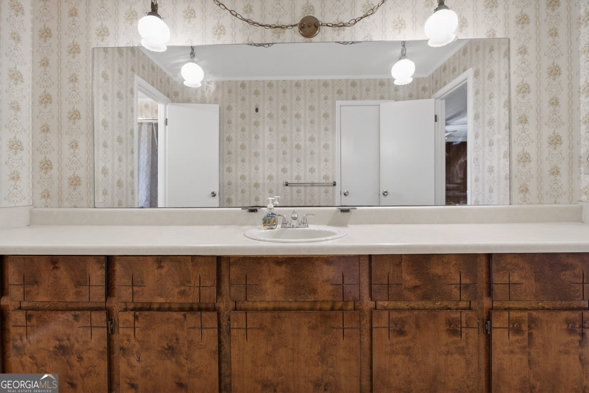 3369 Sandy Circle Macon, GA 31216 - Photo 23 of 65 a bathroom with a sink and a mirror