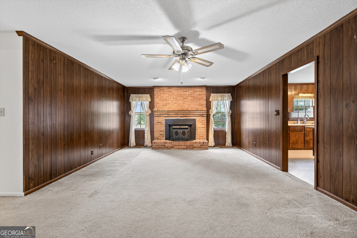 3369 Sandy Circle Macon, GA 31216 - Photo 3 of 65 a view of an empty room with a fireplace and a window