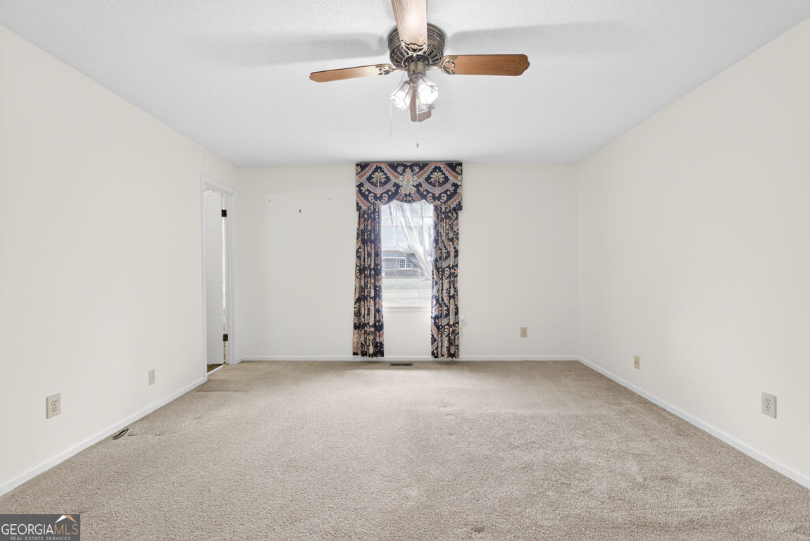 3369 Sandy Circle Macon, GA 31216 - Photo 34 of 65 an empty room with windows and fan