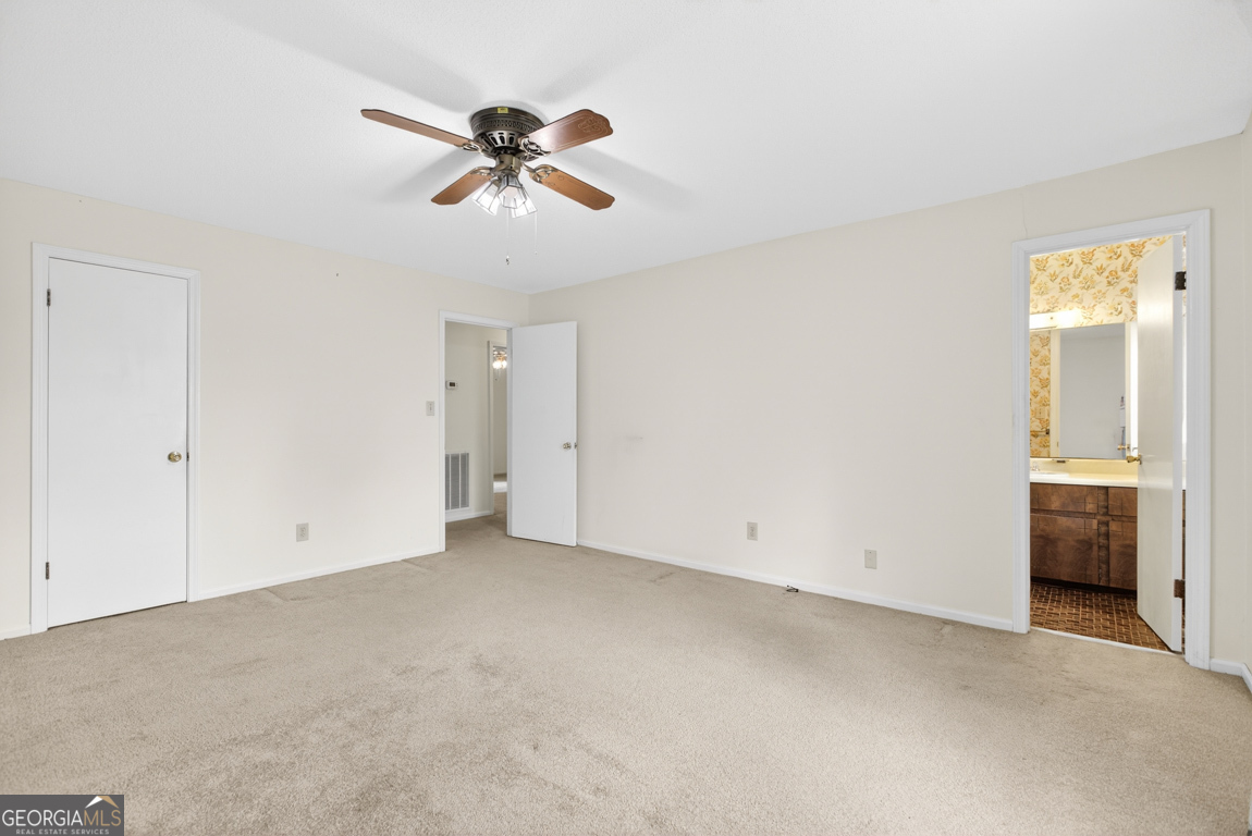 3369 Sandy Circle Macon, GA 31216 - Photo 37 of 65 a view of an empty room with a ceiling fan