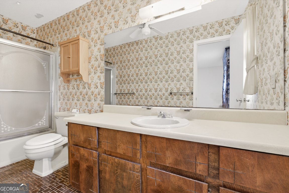 3369 Sandy Circle Macon, GA 31216 - Photo 39 of 65 a bathroom with a sink toilet and shower