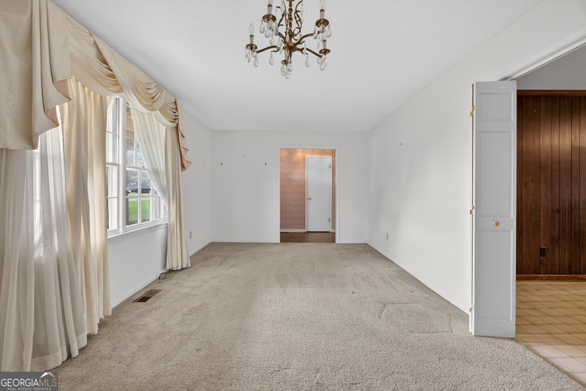 3369 Sandy Circle Macon, GA 31216 - Photo 4 of 65 a view of an empty room with a window