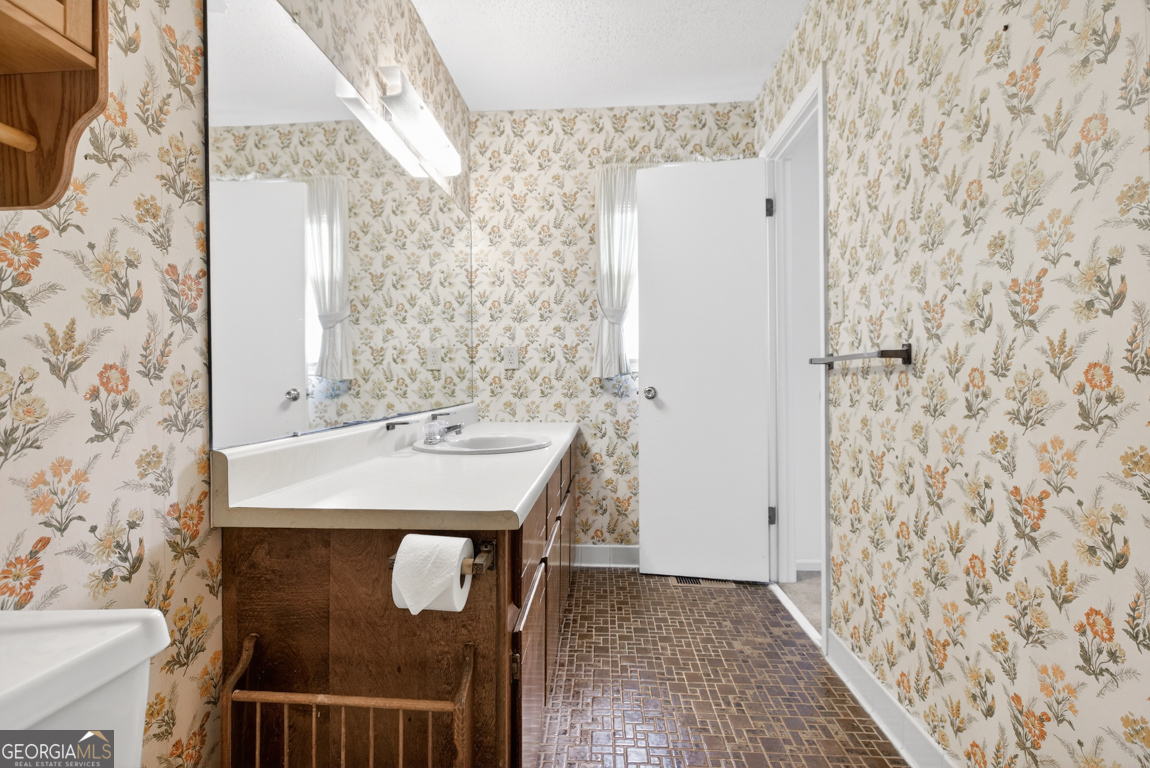 3369 Sandy Circle Macon, GA 31216 - Photo 43 of 65 a bathroom with a sink and a mirror