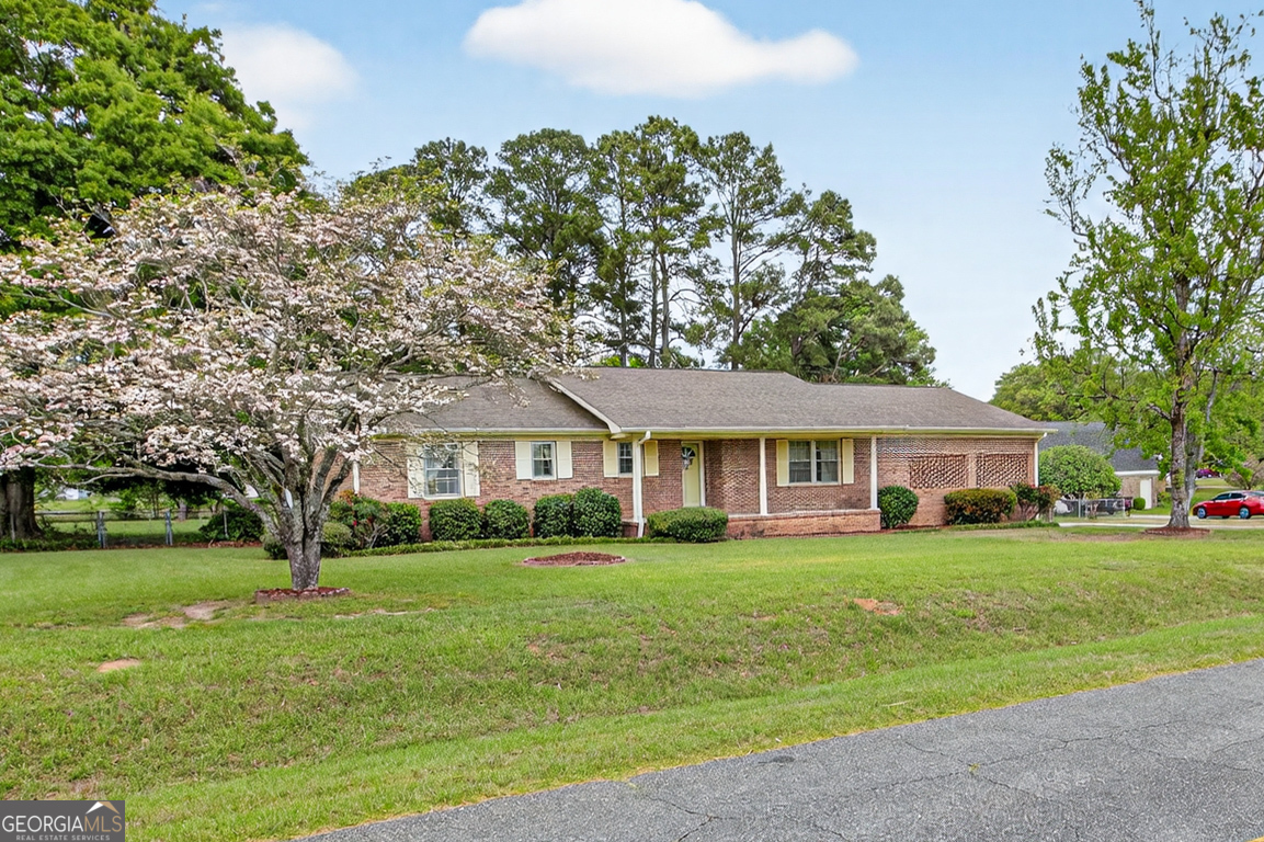 3369 Sandy Circle Macon, GA 31216 - Photo 48 of 65 a front view of a house with a garden