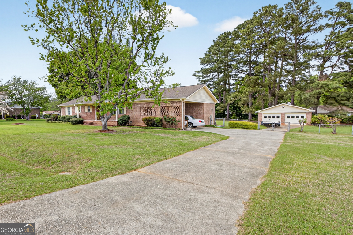 3369 Sandy Circle Macon, GA 31216 - Photo 5 of 65 a view of house with garden and trees