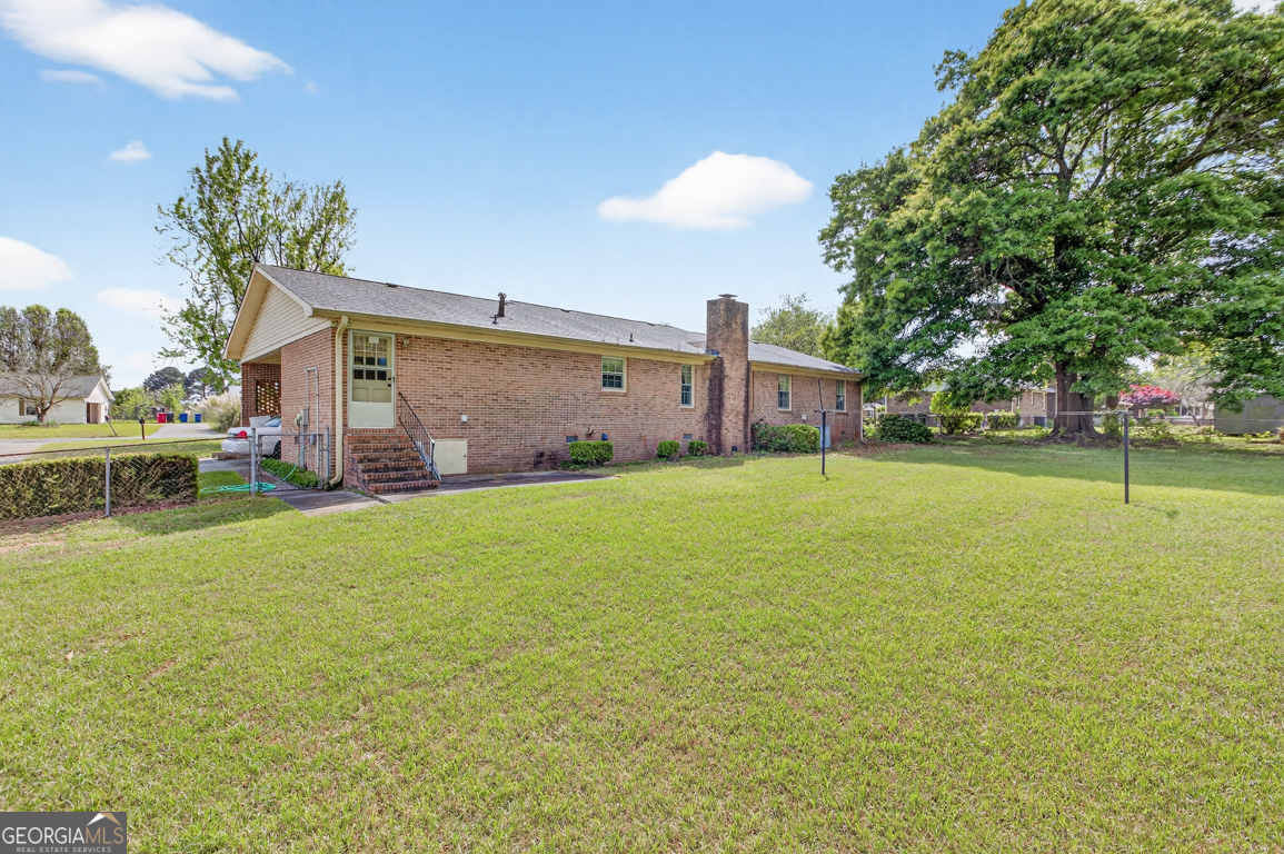 3369 Sandy Circle Macon, GA 31216 - Photo 51 of 65 a front view of house with yard and outdoor seating