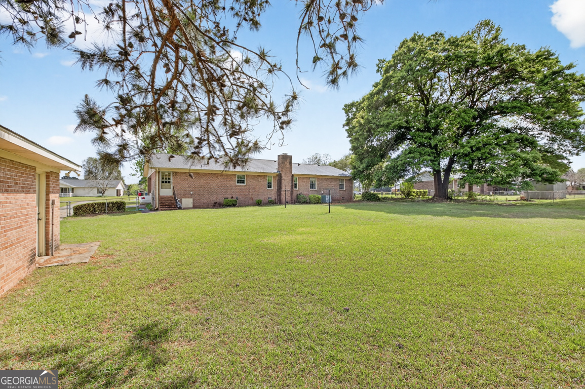 3369 Sandy Circle Macon, GA 31216 - Photo 52 of 65 a view of yard with swimming pool and green space
