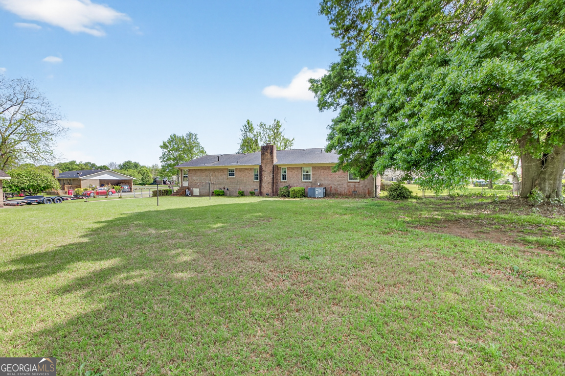3369 Sandy Circle Macon, GA 31216 - Photo 54 of 65 a view of a garden with a building in the background