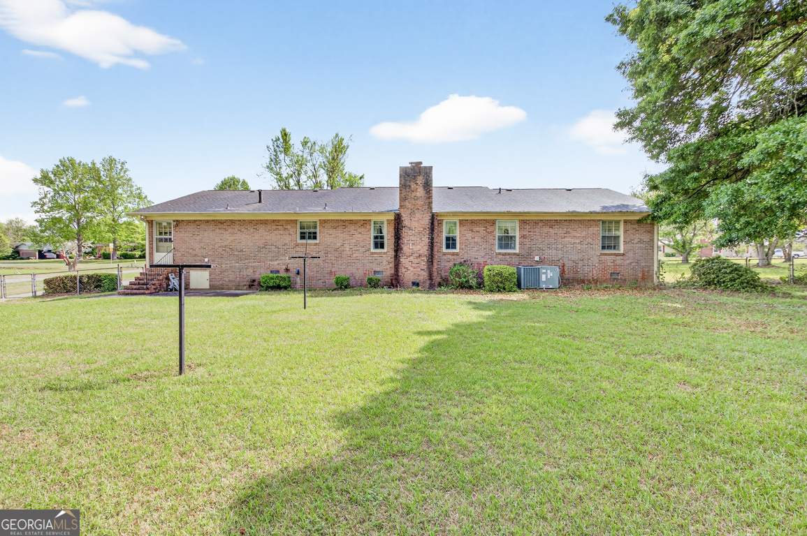 3369 Sandy Circle Macon, GA 31216 - Photo 56 of 65 a house view with swimming pool and garden