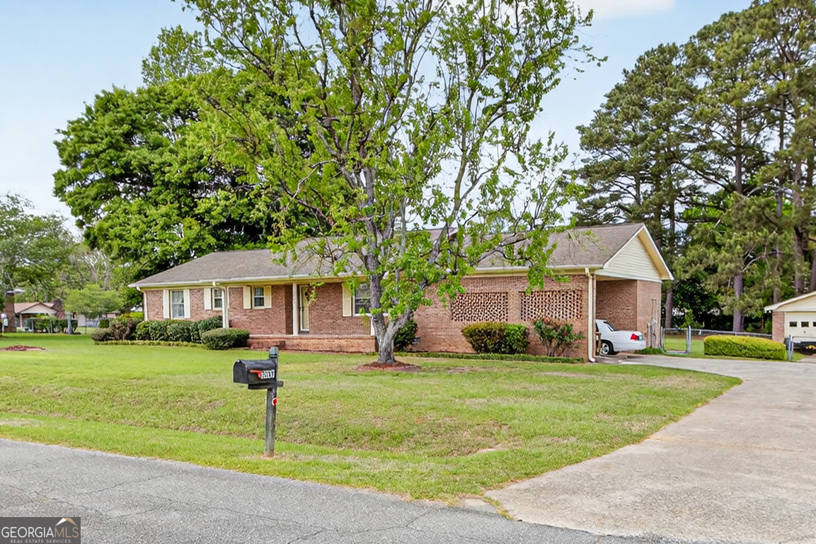 3369 Sandy Circle Macon, GA 31216 - Photo 57 of 65 a front view of house with yard and green space
