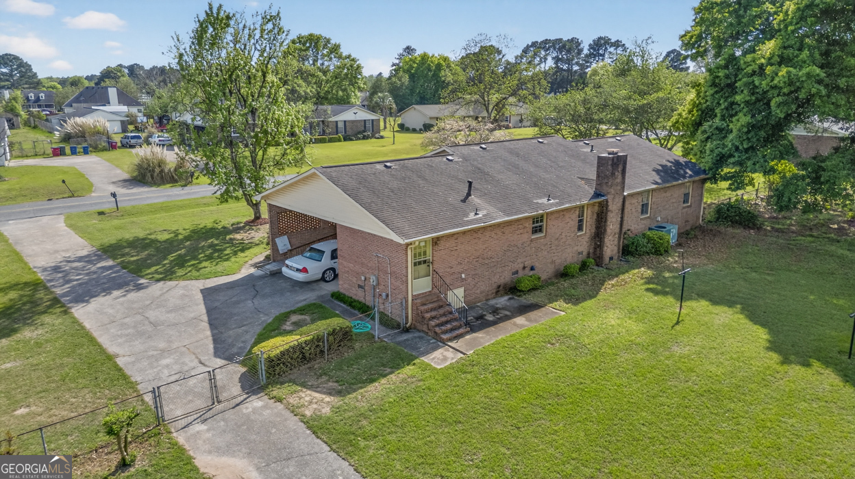 3369 Sandy Circle Macon, GA 31216 - Photo 60 of 65 an aerial view of a house with a yard