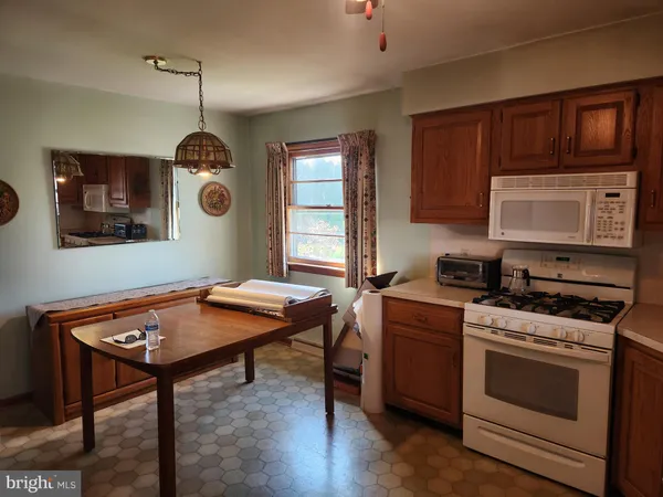 a kitchen with a stove and a microwave