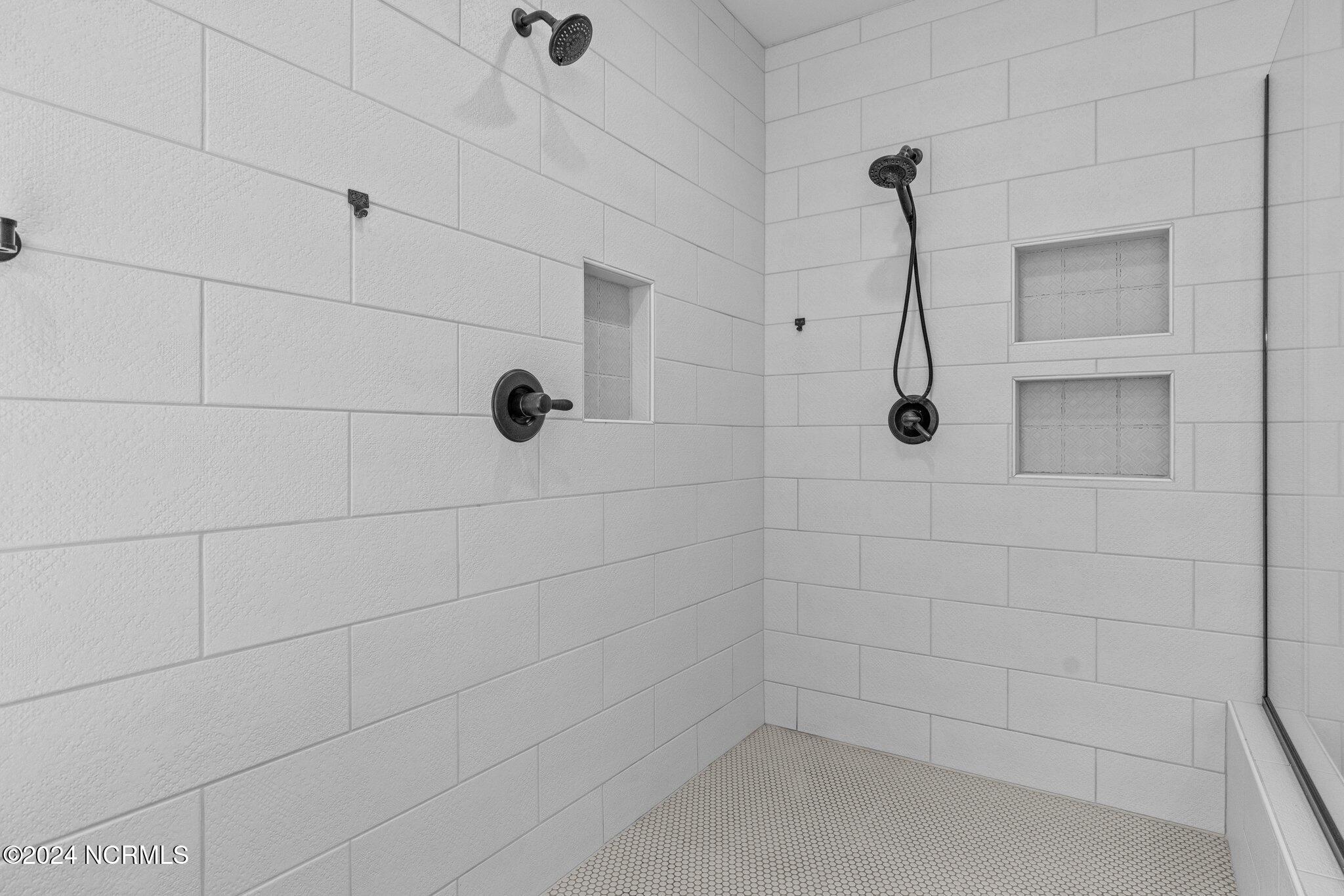 4077 Range Road Stem, NC 27581 - Photo 42 of 67 Massive walk-in shower with handcrafted textured Italian tile.