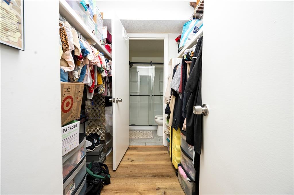 127 Lablanc Way Northwest Atlanta, GA 30327 - Photo 17 of 25 a walk in closet with wooden floor