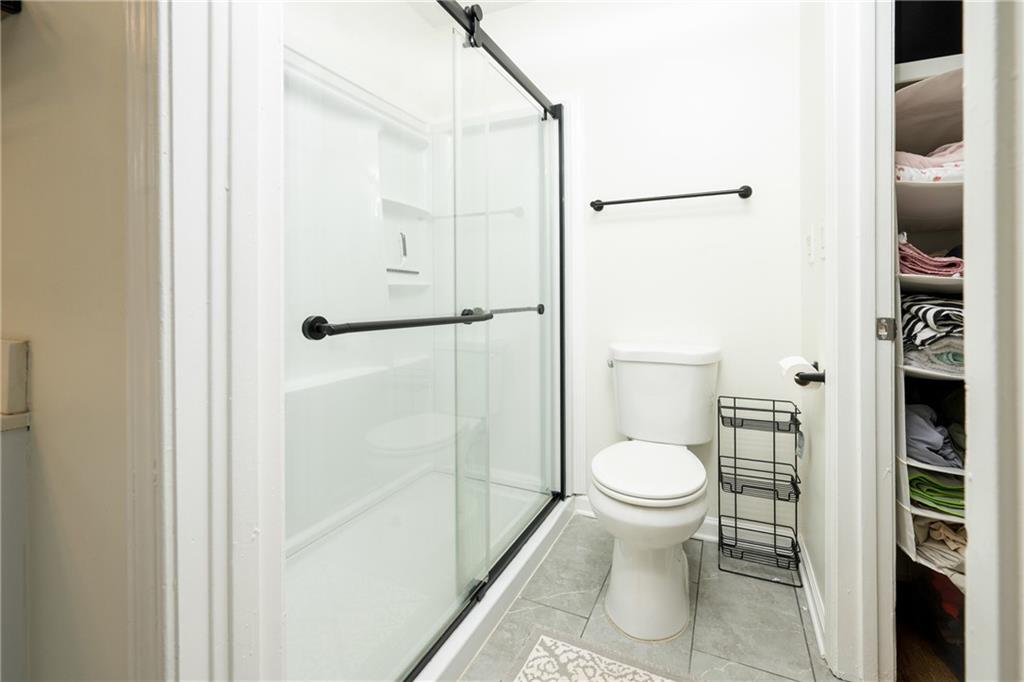 127 Lablanc Way Northwest Atlanta, GA 30327 - Photo 18 of 25 a white toilet sitting next to a bathroom sink