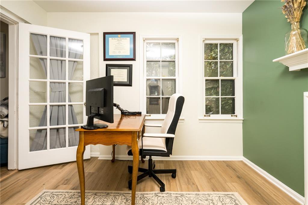 127 Lablanc Way Northwest Atlanta, GA 30327 - Photo 7 of 25 a view of a workspace with furniture and a window