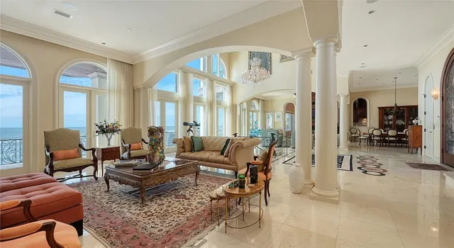 a living room with furniture or couch and a dining table