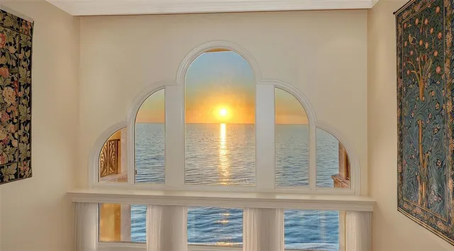 a view of a living room with furniture and wooden floor