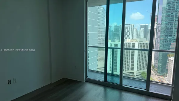 a view of a glass door and a window