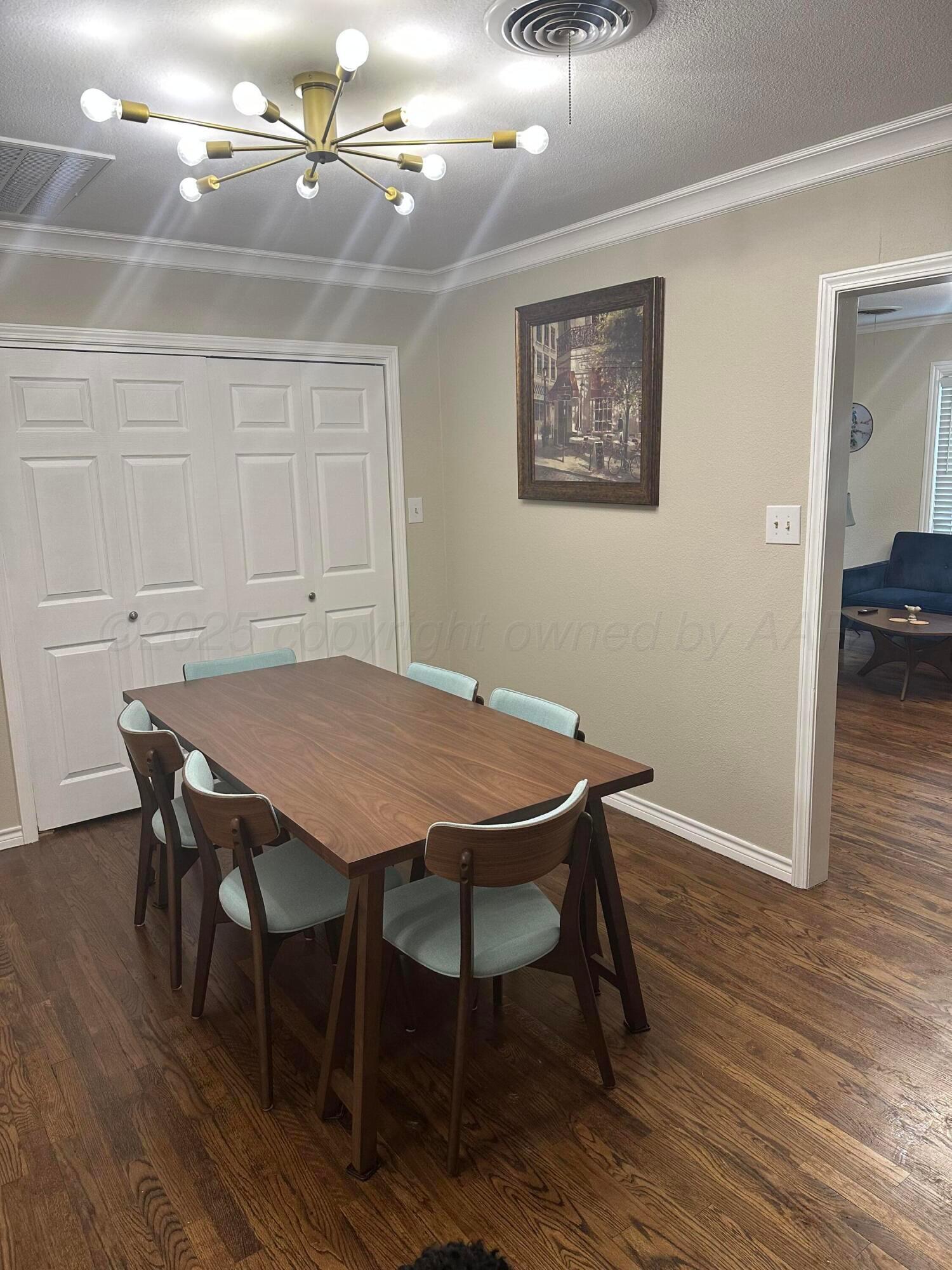 1118 Bellaire Street Amarillo, TX 79106 - Photo 11 of 36 a view of a dining room with furniture and wooden floor