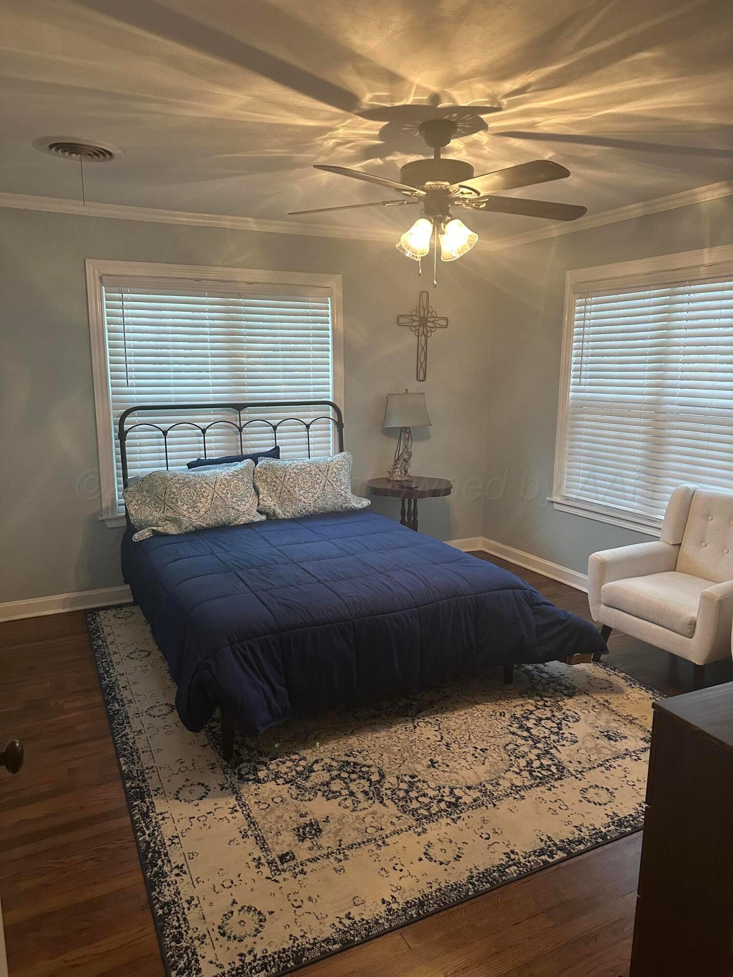 1118 Bellaire Street Amarillo, TX 79106 - Photo 14 of 36 a bedroom with a bed window and couch
