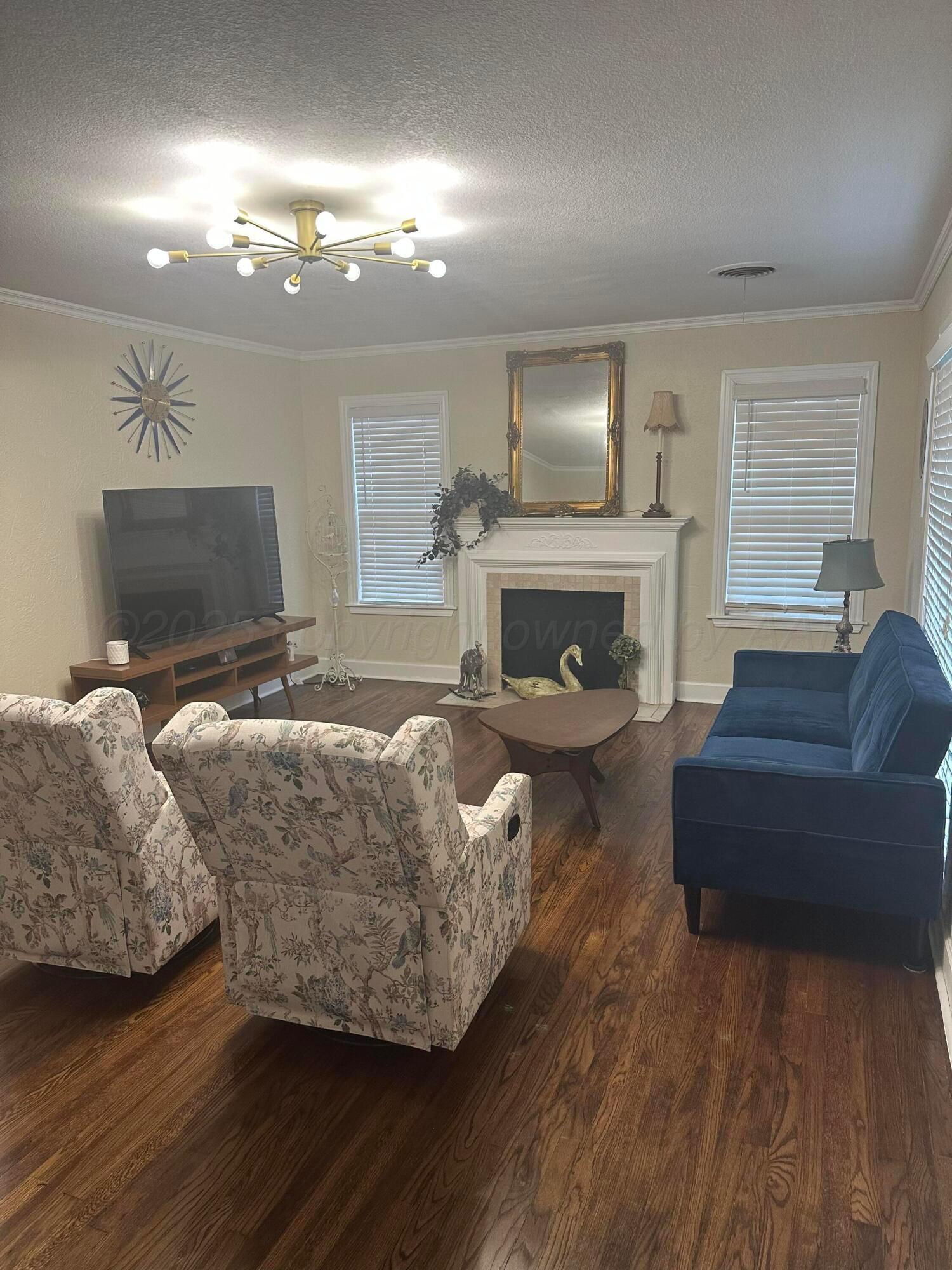 1118 Bellaire Street Amarillo, TX 79106 - Photo 2 of 36 a living room with furniture and a fireplace