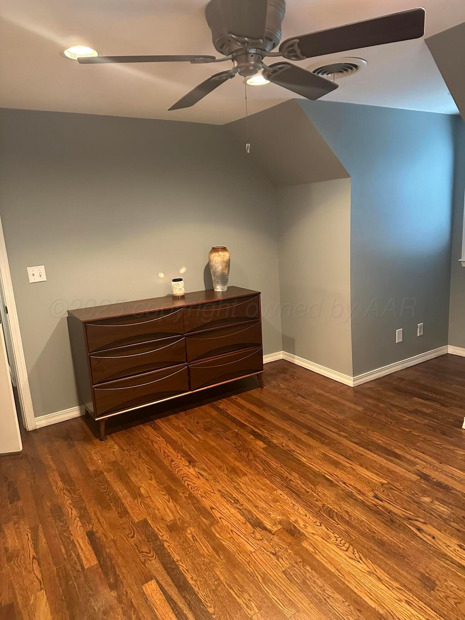 1118 Bellaire Street Amarillo, TX 79106 - Photo 30 of 36 a view of room with wooden floor and fan