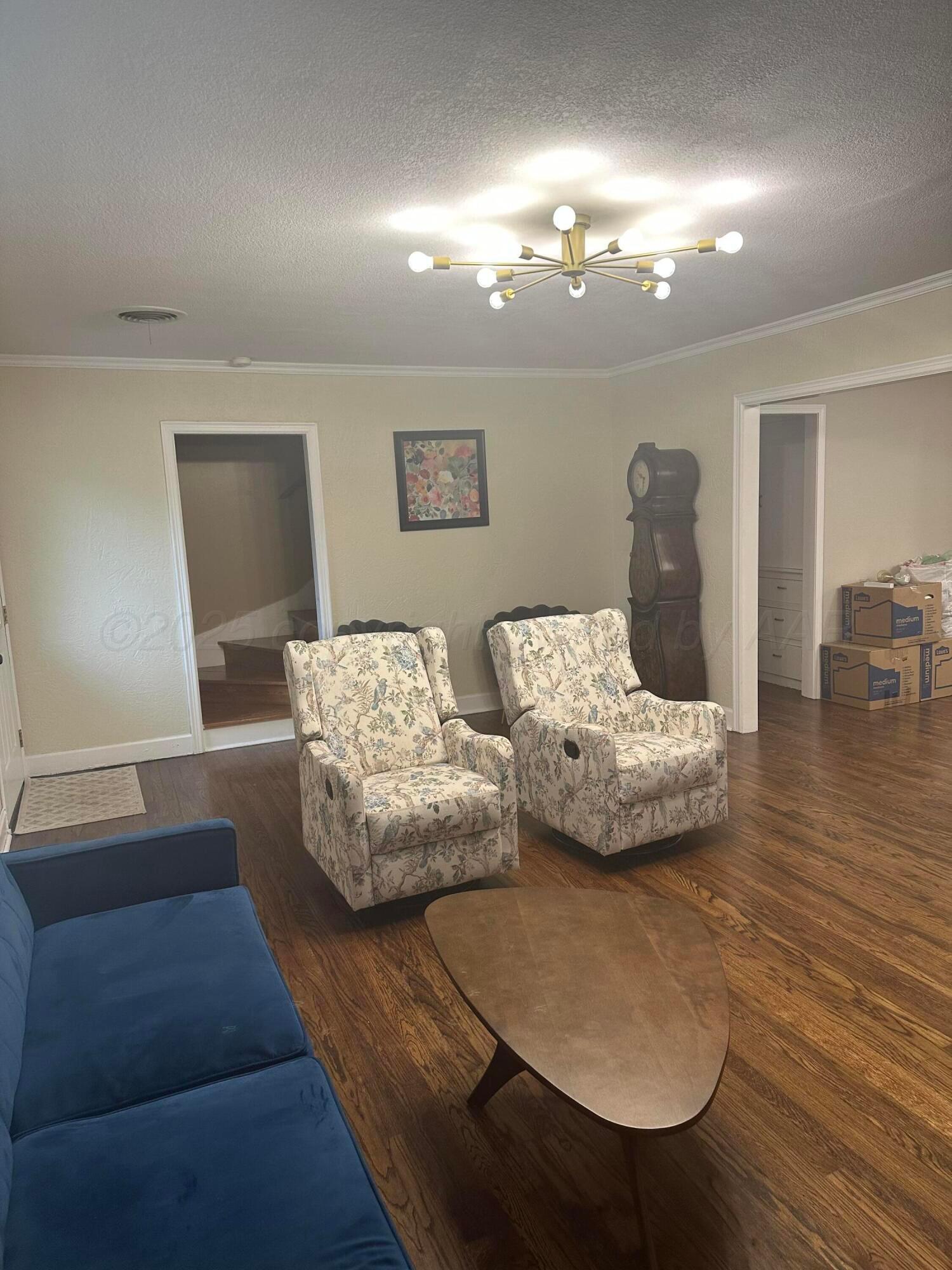 1118 Bellaire Street Amarillo, TX 79106 - Photo 4 of 36 a bedroom with furniture and wooden floor